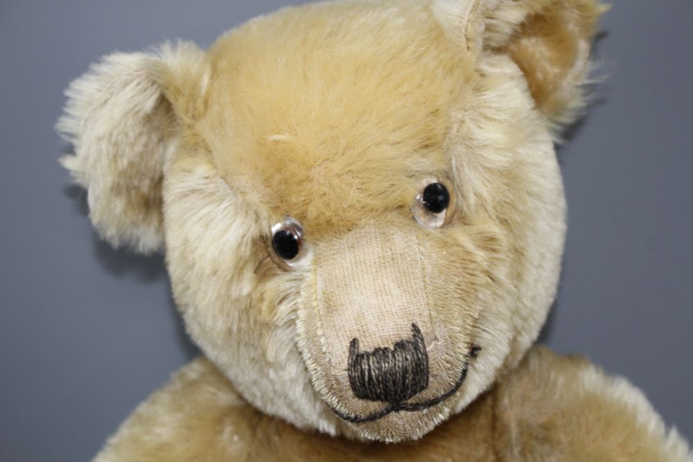 A Chiltern Hugmee bear c.1930s, 19in., blond mohair, good condition, glass eyes and velvet pads